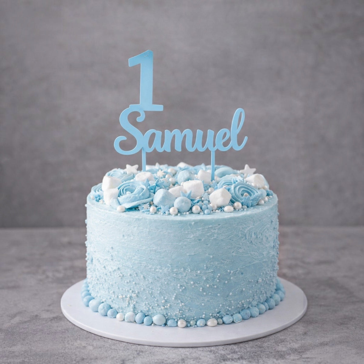 Cake topper personalizzato FotoGrafica azzurro con numero 1 e nome Samuel su torta decorata per primo compleanno