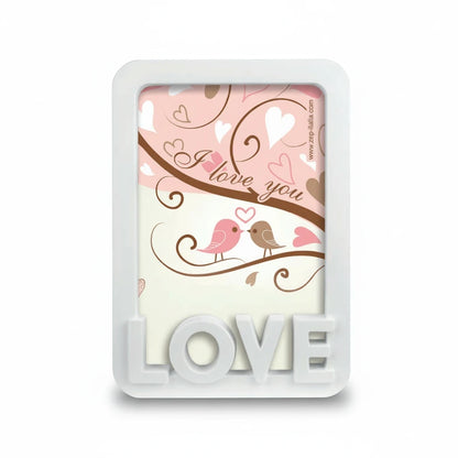 Cornice da tavolo FotoGrafica bianca con scritta Love in rilievo e decorazione romantica con uccellini e cuori