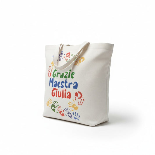 Shopper in tela bianca personalizzata FotoGrafica con scritte colorate e impronte di mani per maestra